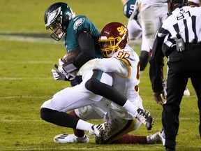 Washington Football Team defensive end Montez Sweat sacks Philadelphia Eagles quarterback Nate Sudfeld.