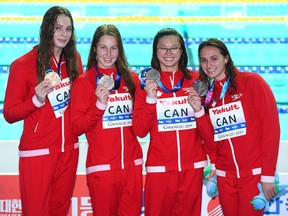Bronze medalists Kylie Masse, Sydney Pickrem, Margaret MacNeil and Penny Oleksiak of Canada.