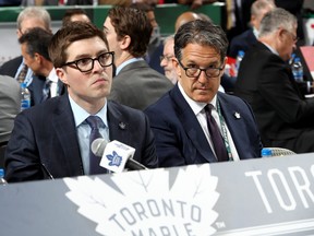 Maple Leafs GM Kyle Dubas (left) and president Brendan Shanahan handle the draft table during the 2018 NHL Draft.