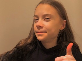 Activist Greta Thunberg gestures in a photo which was posted with a message thanking her supporters for their well wishes for her 18th birthday, in this undated picture taken from social media.