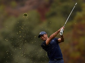 Tiger Woods hits a fairway shot on the 18th hole during the third round of the Zozo Championship golf tournament at Sherwood Country Club in Thousand Oaks, Calif., Oct. 24, 2020.
