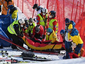 Tommy Ford is evacuated on a stretcher as he receives medication after falling while competing in the Men's Giant Slalom race during the FIS Alpine ski World Cup on January 9, 2021, in Adelboden.
