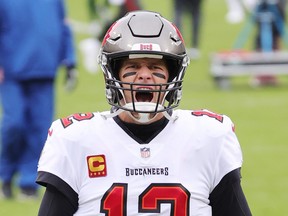 Quarterback Tom Brady of the Tampa Bay Buccaneers warms up prior to their NFC Championship game against the Green Bay Packers at Lambeau Field on Jan. 24, 2021 in Green Bay, Wisc..