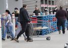 Costco customers line up for products in East York on March 26, 2020.  