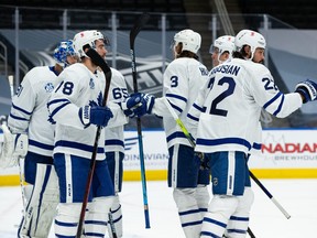 The Toronto Maple Leafs celebrate their 4-3 victory over the Edmonton Oilers at Rogers Place in Edmonton, on Thursday, Jan. 28, 2021.