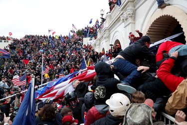 Pro-Trump protesters storm into the U.S. Capitol during clashes with police, during a rally to contest the certification of the 2020 U.S. presidential election results by the U.S. Congress, in Washington, U.S, January 6, 2021. REUTERS/Shannon Stapleton