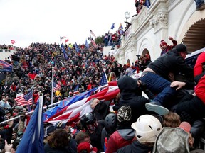 Pro-Trump protesters storm into the U.S. Capitol during clashes with police, during a rally to contest the certification of the 2020 U.S. presidential election results by the U.S. Congress, in Washington, Jan. 6, 2021.