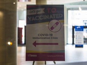 A sign for a COVID-19 Immunization Clinic at the Metro Toronto Convention Centre on Sunday January 17, 2021.