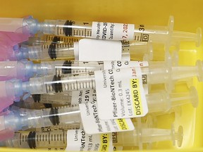 Prepared syringes of the Pfizer-BioNTech COVID-19 vaccine