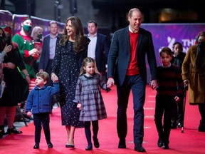 Prince William, Catherine, Duchess of Cambridge and their children, Prince Louis, Princess Charlotte and Prince George attend a special pantomime performance.