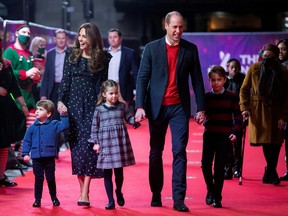 Prince William, Catherine, Duchess of Cambridge and their children, Prince Louis, Princess Charlotte and Prince George attend a special pantomime performance.