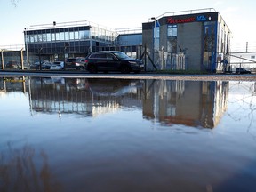The Wockhardt pharmaceutical plant is reflected in a puddle in Wrexham, Britain January 21, 2021.
