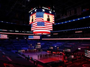 The Suns and Wizards stand during the U.S. National Anthem at Capital One Arena in Washington, D.C., Jan. 11, 2021.