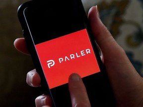 This illustration file photo taken on July 2, 2020 shows social media application logo Parler displayed on a smartphone in Arlington, Virginia.