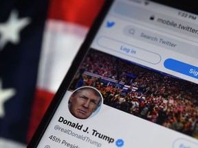 In this photo illustration, the Twitter account of U.S. President Donald Trump is displayed on a mobile phone on August 10, 2020, in Arlington, Va.