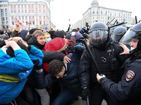 Protesters clash with riot police during a rally in support of jailed opposition leader Alexei Navalny in downtown Moscow on January 23, 2021.