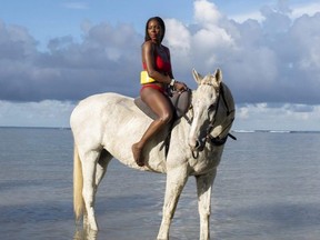 Ottawa-based style and travel influencer Dominique Baker, who was also a manager with the Public Health Agency of Canada at the time, rides a horse in Montego Bay, Jamaica in November 2020.