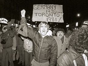 Protest at the corner of Yonge and Wellesley Sts. following bathhouse raids by the Toronto Police, Feb. 6, 1981.