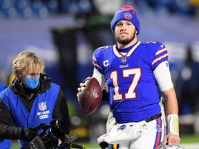 Buffalo Bills quarterback Josh Allen walks on the field after their win over the Baltimore Ravens during the second half of an AFC Divisional Round playoff game at Bills Stadium. The Buffalo Bills won 17-3.
