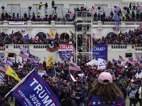 A mob storms the Capitol on Wednesday, Jan. 6, 2021. MUST CREDIT: Washington Post photo by Bonnie Jo Mount