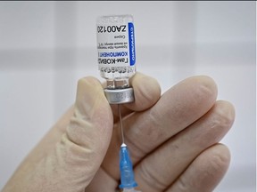 A medical worker fills a syringe with Sputnik V (Gam-COVID-Vac) vaccine as she prepares to vaccinate a Russian Army service member at a clinic in the city of Rostov-On-Don, Russia December 22, 2020.