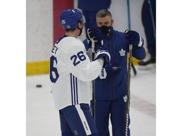 Toronto Maple Leafs Jimmy Vesey LW (26) speaks with head coach Sheldon Keefe at practice in Toronto on Tuesday January 12, 2021. Jack Boland/Toronto Sun/Postmedia Network