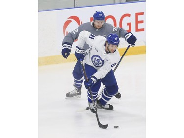 Toronto Maple Leafs John Tavares C (91) tries to get away from Travis Boyd RW (72) at practice in Toronto on Tuesday January 12, 2021. Jack Boland/Toronto Sun/Postmedia Network