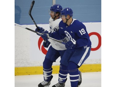 Toronto Maple Leafs Jason Spezza C (19) andJohn Tavares C (91) joust along the blue line at practice in Toronto on Tuesday January 12, 2021. Jack Boland/Toronto Sun/Postmedia Network