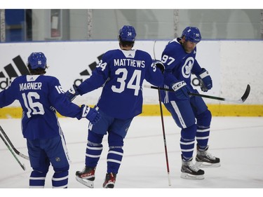 Toronto Maple Leafs Joe Thornton C (97) celebrates potting a goal with Auston Matthews C (34)] at practice in Toronto on Tuesday January 12, 2021. Jack Boland/Toronto Sun/Postmedia Network