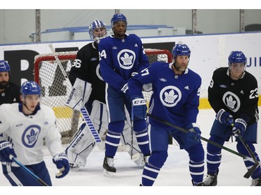 Toronto Maple Leafs Wayne Simmonds RW (24) dosing what he does best causing interference in front of Jack Campbell G (36) at practice in Toronto on Tuesday January 12, 2021. Jack Boland/Toronto Sun/Postmedia Network