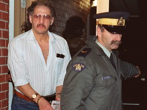 Allan Legere departs from court in Burton, N.B., as he waits for jurors in his murder trial to return a verdict on Nov. 2, 1991.
