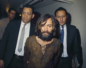 Got him. LAPD homicide detectives escort cult leader Charles Manson.