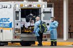 Paramedics transport a person from Roberta Place, a long-term care facility that is the site of a COVID-19 outbreak in Barrie on Jan. 18, 2021.