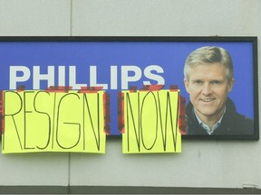 Homemade signs were taped to signage outside the plaza on Rossland Rd. West in Ajax where former Ontario Finance minister Rod Phillips has his constituency office.