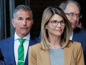 Actor Lori Loughlin, and her husband, fashion designer Mossimo Giannulli, leave the federal courthouse after facing charges in a nationwide college admissions cheating scheme, in Boston, Massachusetts, U.S., April 3, 2019.