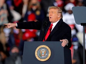 U.S. President Donald Trump gestures while campaigning for Republican Senator Kelly Loeffler on the eve of the run-off election to decide both of Georgia's Senate seats, in Dalton, Georgia, U.S., January 4, 2021.