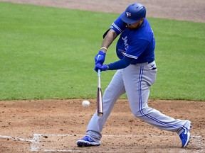 Blue Jays' Rowdy Tellez hits a single to centre field during Sunday's game against the New York Yankees.
