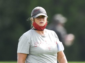 Assistant defensive line coach Lori Locust of the Tampa Bay Buccaneers looks on during training camp.