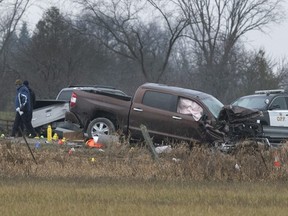Investigators examine the scene on County Road 17 in Kawartha Lakes, Ont., after a deadly police shooting on Nov. 26, 2020
