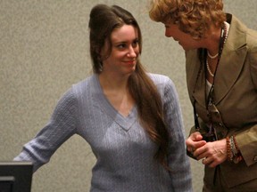 Casey Anthony (left) enters the courtroom with her attorney Dorothy Clay Sims for her sentencing hearing on charges of lying to a law enforcement officer at the Orange County Courthouse on July 7, 2011 in Orlando, Fla.  Anthony was acquitted of murder charges on July 5, 2011, but will serve four,  one-year sentences on her conviction of lying to a law enforcement officer.