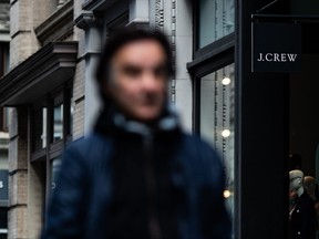 A person walks past a J. Crew Store on May 1, 2020 in New York City. Clothing apparel company J. Crew is preparing to file for bankruptcy protection.