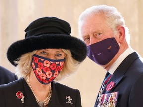 Prince Charles, Prince of Wales and Camilla, Duchess of Cornwall, look back after visiting the Neue Wache memorial to victims of war and tyranny on November 15, 2020 in Berlin.