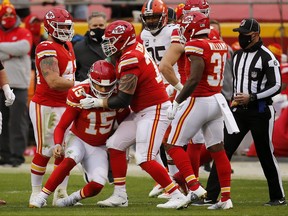 Chiefs quarterback Patrick Mahomes is assisted to his feet by offensive tackle Mike Remmers after a sack. Remmers will start at left tackle in the Super Bowl.