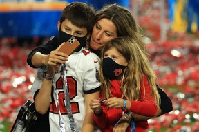 Gisele Bundchen celebrates with Vivian Brady and Benjamin Brady after the Buccaneers defeated the Kansas City Chiefs in Super Bowl LV at Raymond James Stadium on February 07, 2021 in Tampa, Florida. The Buccaneers defeated the Chiefs 31-9.