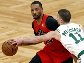 Raptors’ Norman Powell makes a move on the Celtics’ Payton Pritchard on Friday. Powell has been excelling as a starter for the team.