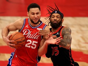 Sixers' Ben Simmons (left) drives against Raptors' DeAndre' Bembry on Sunday, Feb. 21, 2021 at Amalie Arena in Tampa, Fla.