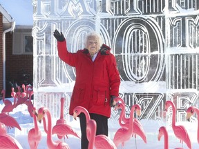 Former Mississauga mayor Hazel McCallion is pictured on her front lawn on her 100th birthday. A large ice sculpture and pink flamingos helped mark the day, Feb. 14, 2021.
