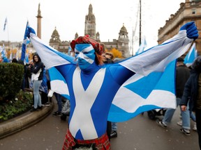 A demonstrator holds a flag during a pro-Scottish Independence rally in Glasgow, Scotland, November 2, 2019.