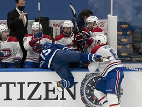 Montreal Canadiens defenveman Shea Weber (6) checks Toronto Maple Leafs centre Alexander Kerfoot (15) into the Montreal bench during the second period at Scotiabank Arena.