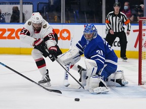 Ottawa Senators' Artem Anisimov (51) and Maple Leafs goaltender Frederik Andersen reach for a rebound during the second period at Scotiabank Arena on Wednesday, Feb. 18, 2021.
